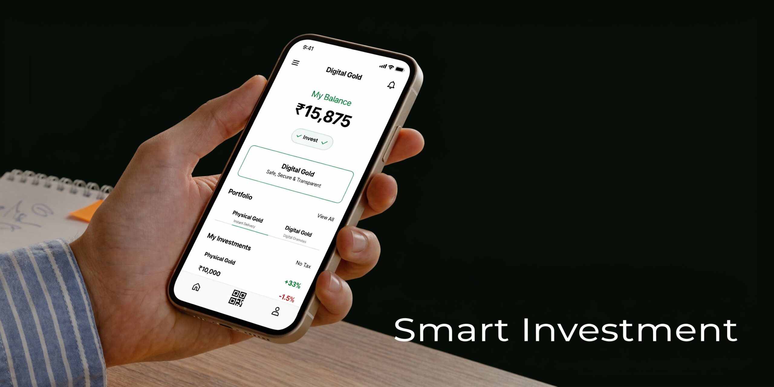 A close-up of a person's hand holding a smartphone displaying a digital gold investment application interface.